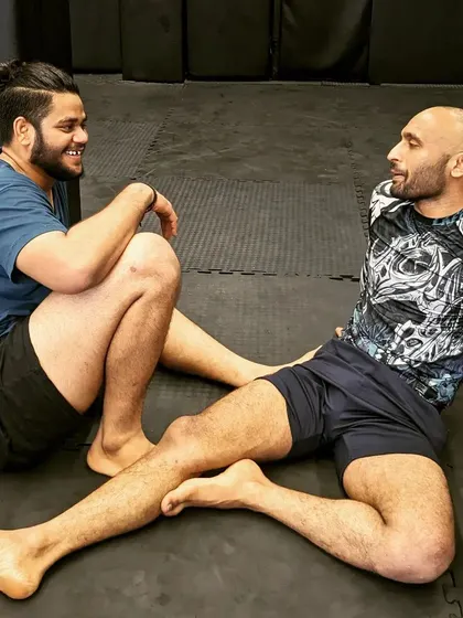 After the roll. The exhaustion is real, but so is the friendship and respect between training partners.