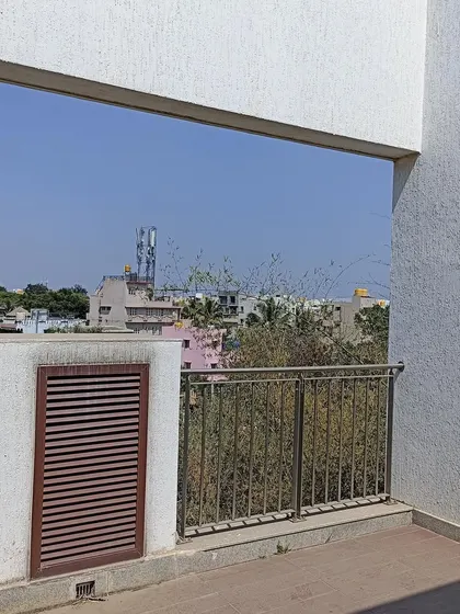 Before: The balcony in the 'A Walk in the Clouds' villa was a simple, open space.
