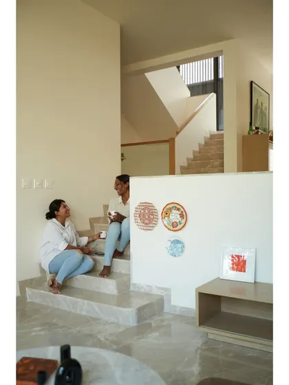 Another view of the informal seating on the steps, showcasing how architectural elements can become social spaces.