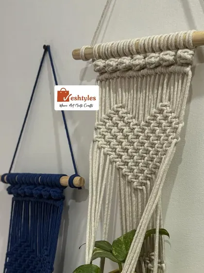 A close-up of the knot details on the navy and beige plant hangers. The quality of the craftsmanship is what makes these pieces last.