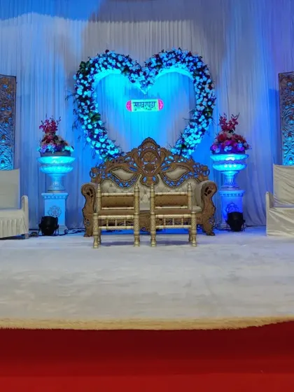 This is the same heart-themed engagement stage, but with blue lighting. I can change the lighting to match your event's color scheme, completely changing the mood of the setup.