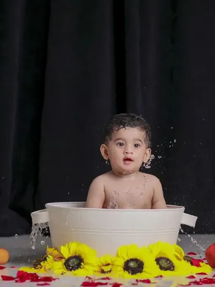 Splish, splash, fun in the tub. The surprise on his face is a priceless memory.