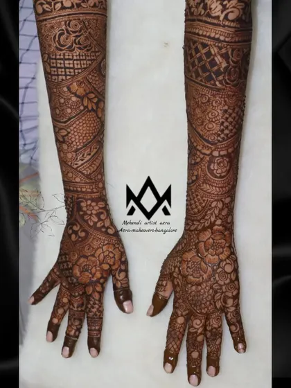 A beautiful example of a full coverage bridal design, blending different textures and patterns for a rich look.