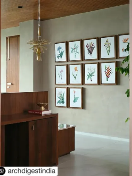 Architectural Digest India featured our work on the AMC Chairman's office. This image from the feature shows the elegant entryway with its custom art and lighting.