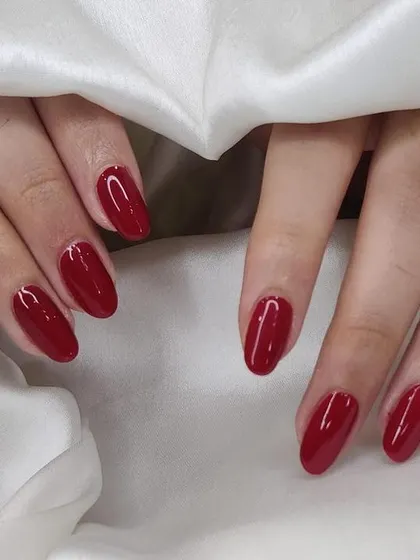 A deep, classic red gel manicure. This color is sophisticated and perfect for any season or occasion.