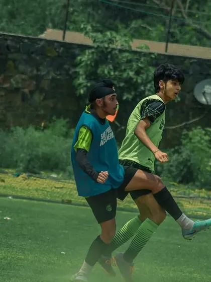 A high-flying kick during an intense moment of the game.