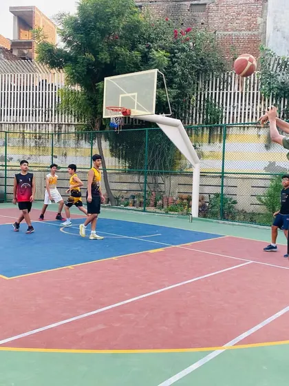 A player jumps for a shot in the paint.