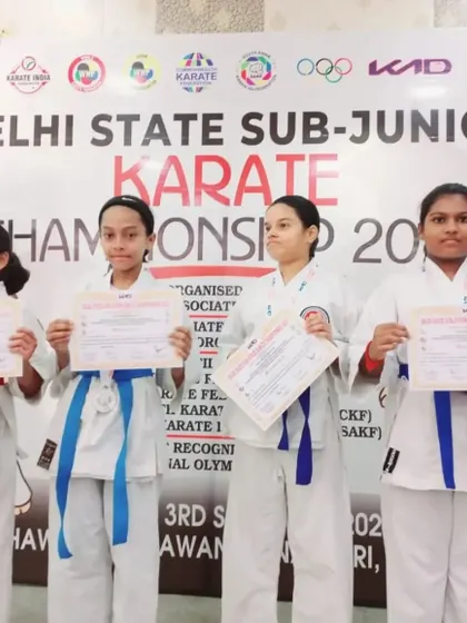 Our girls team proudly displaying their certificates. These achievements are a direct result of their consistent training and the supportive community within our dojo.