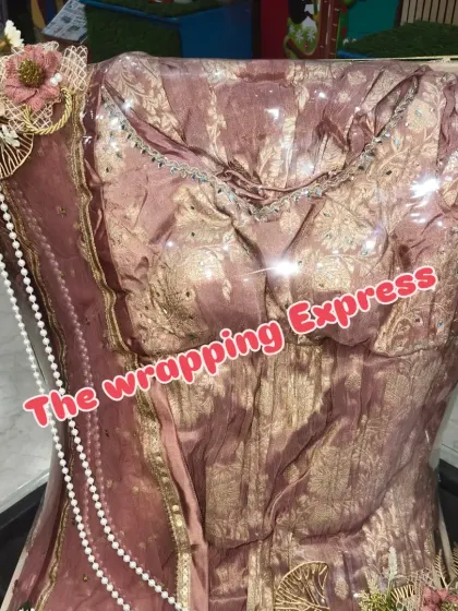 Another view of the pink and gold outfit, showing the intricate work and the way I use lighting within the packing to make it sparkle.