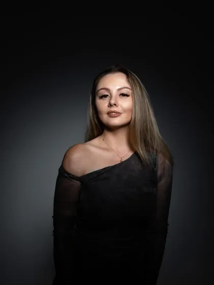 A moody, artistic portrait used for a mixtape feature, with a spotlight creating a dramatic effect.