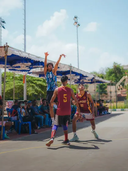 Contesting a shot at the rim. Our players are trained to be relentless defenders, whether indoors or outdoors.