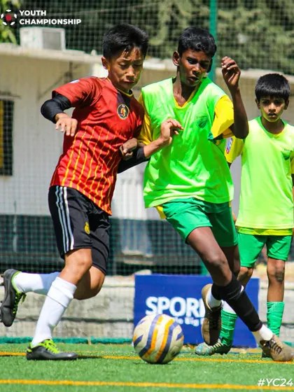 A tough tackle during a Youth Championship match, showing the competitive nature of the game.