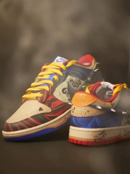 Another moody shot of the Harley Quinn custom Dunks. The colors, textures, and spikes all work together to create a really unique piece.