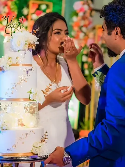 A happy client enjoying her four-tier spacer cake. I love working with clients who trust my creative vision to bring their dream cake to life for their special day.