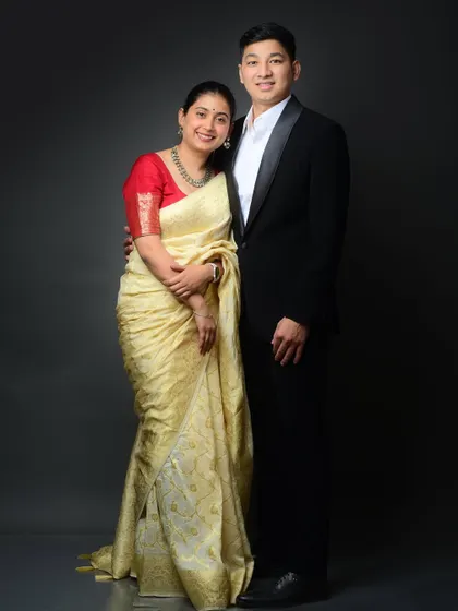 A classic and formal pre-wedding portrait. The combination of a beautiful saree and a sharp tuxedo makes for a truly elegant and timeless image.