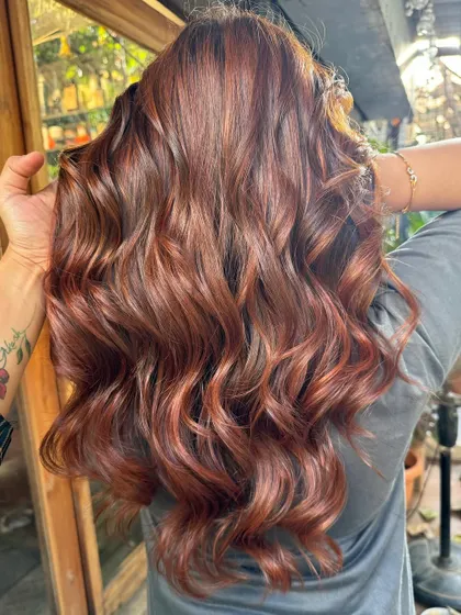 A close-up of the non-bleach copper tones. The hair looks incredibly healthy and shiny.