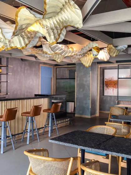 This bar and lounge area features furniture crafted by our DCA Workshop. We blend innovative design with local talent to create sophisticated pieces that stand apart from mass-produced options, reflecting our commitment to precision and conscious creation.