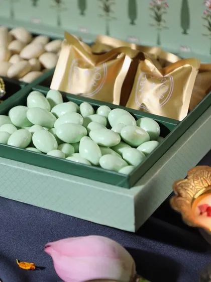 A close-up of the premium nuts featured in our Diwali hampers, including pista white chocolate almonds. We source only the best ingredients.