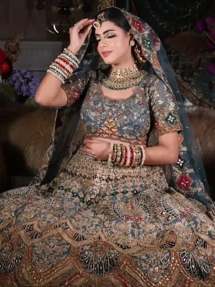 This pose highlights the maang tikka and the soft contouring on the face. It's a perfect example of the kind of portfolio shots my students learn to create.