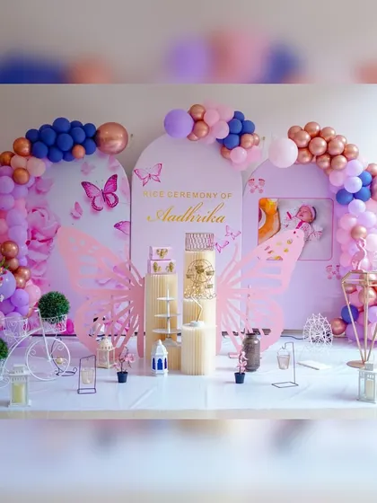 I love creating modern decor for traditional events like this Annaprashan, or rice ceremony. This elaborate butterfly theme uses multiple backdrops, custom butterfly wing cutouts, and a soft pink and lavender color scheme to create a magical setting.