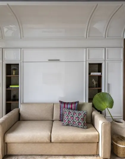 Art defines this Neo-Classical guest bedroom. A quiet still life of lemons becomes a bold statement, adding a touch of the unexpected to a traditional space.
