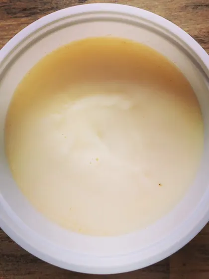 A top-down view of the smooth, golden pork lard. This is a traditional cooking fat that adds a smoky, rich taste to any dish.