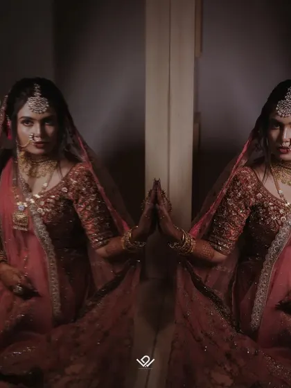 A creative reflection shot of a bride, creating a symmetrical and visually interesting portrait.