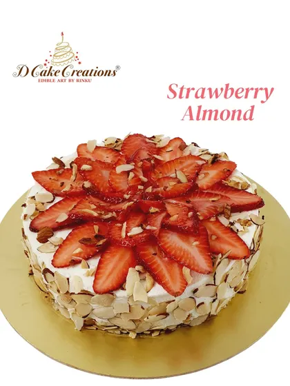 A delicious strawberry almond cake, featuring a ring of toasted almonds and a topping of fresh strawberries.