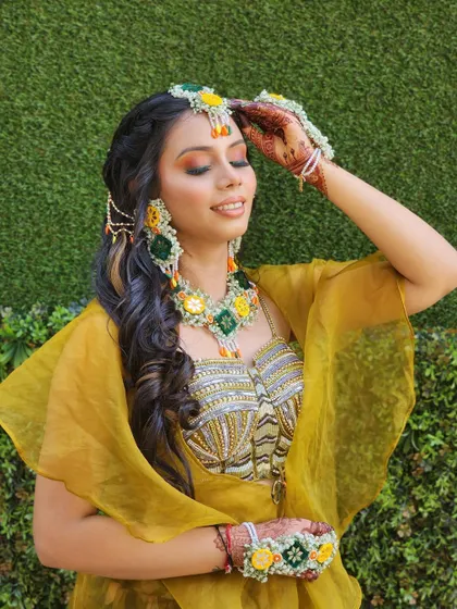 A full view of the mehendi outfit, showing the stylish cape and printed skirt. It's a comfortable, chic, and photo-ready choice for your special day.