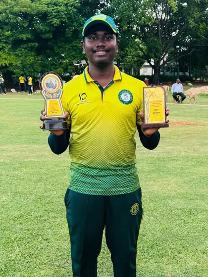 A player proudly displays his Man of the Match and Best Batsman trophies from the Chennai tour.