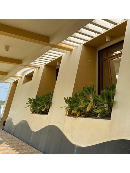 A detail of the CC Office's tapered facade from 2002. The undulating base and recessed planters are early examples of our interest in creating dynamic building surfaces that interact with light and shadow.