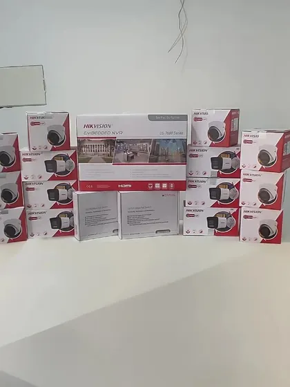 A complete Hikvision IP camera kit, including an embedded NVR and multiple 2MP dome cameras with audio, ready for a client's site.