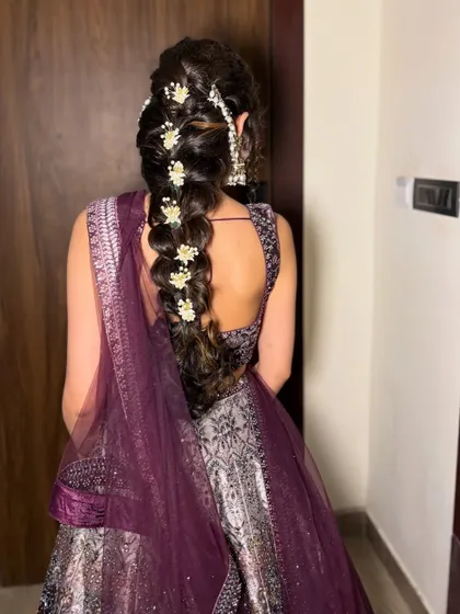 A back view of the same hairstyle, showing the full length of the braid.