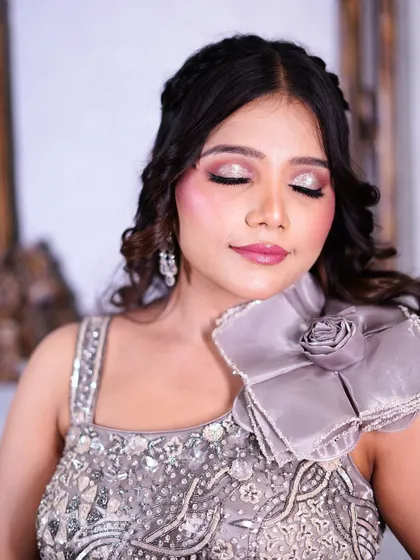 A close-up of the beautiful rose detail on the shoulder of the grey gown.