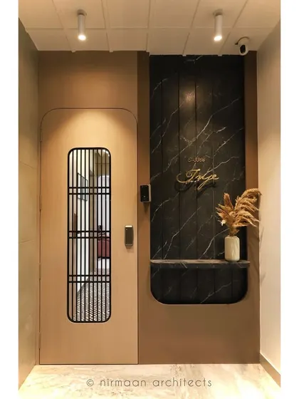 A modern classic entrance at our Atmosphere project. The design combines a sleek door with a dramatic black marble panel and gold lettering for a sophisticated first impression.