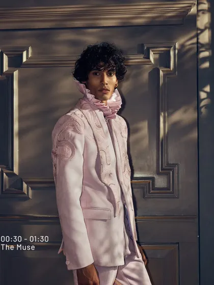 From my 'The Muse' series, this soft pink jacket with a ruffled collar is where style and energy meet. It is a look for an evening that blooms with exalting flair.