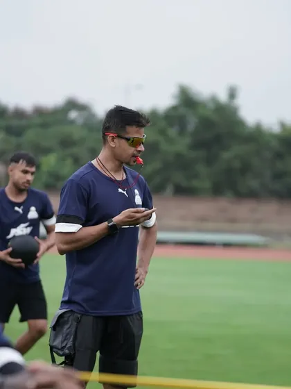Whistle in mouth, stopwatch in hand. A typical day at the office, overseeing a conditioning session.
