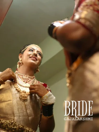A beautiful mirror portrait of the bride, Gajalakshmi, as she gets ready for her big day.
