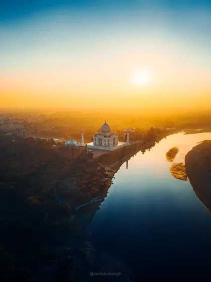 A slightly different crop of my iconic Taj Mahal drone shot. This version emphasizes the warm, golden tones of the sunset and the peacefulness of the scene.