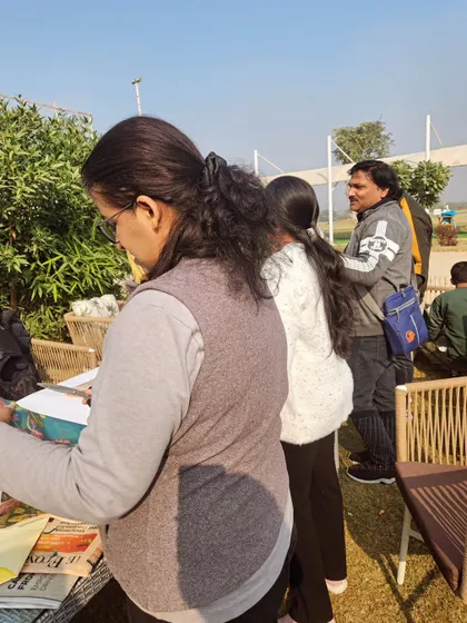 Participants at an art workshop, getting ready to create. I provide the tables and space for groups to set up their activities.