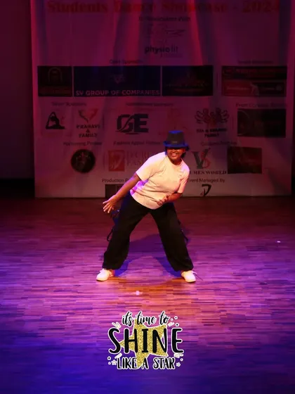 A confident pose from a solo hip-hop dancer.