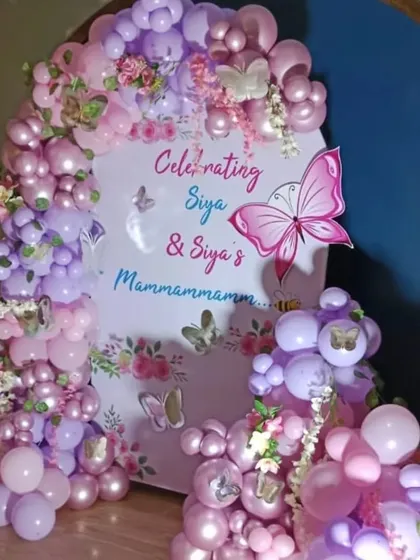A joint celebration for Siya and her grandmother with a lovely butterfly theme. The decor uses shades of pink and purple balloons with delicate butterfly accents.