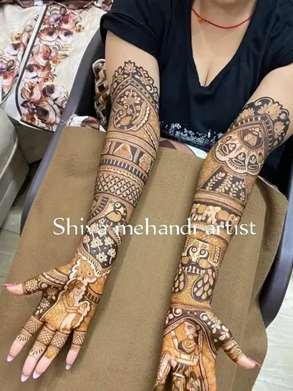 A full-sleeve design filled with classic Indian art elements. It features a bride in a doli, elephants, peacocks, and intricate geometric patterns.