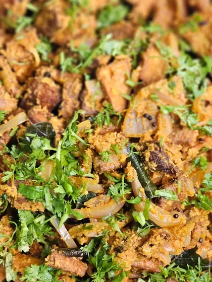A delicious dry vegetable preparation, garnished with plenty of fresh coriander.