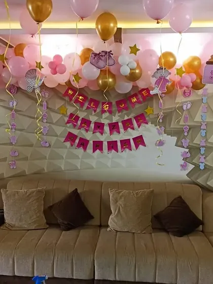 A wider view of the welcome home decorations in a living room.