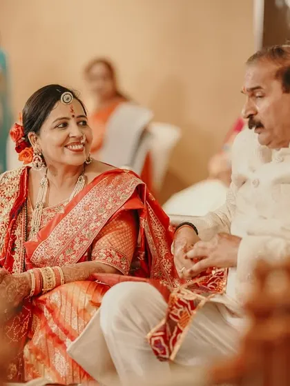 A duplicate of the happy parents (ID 153), a beautiful candid moment of shared joy.