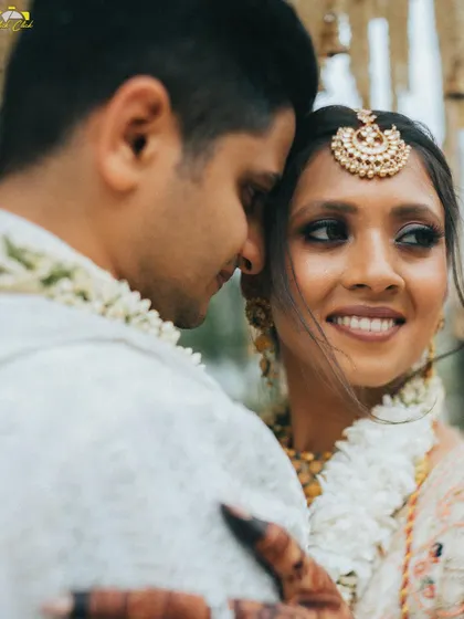 An intimate close-up of the couple. The bride's happy, loving gaze is the focus of this beautiful and emotional portrait.