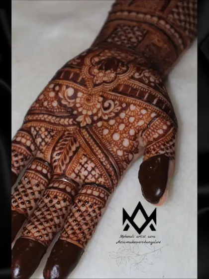 A close-up of the palm, showcasing the detailed work and patterns of a bridal design.