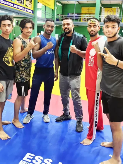 The team on the mats in Jammu. We travel together to compete and represent our akhada with pride.
