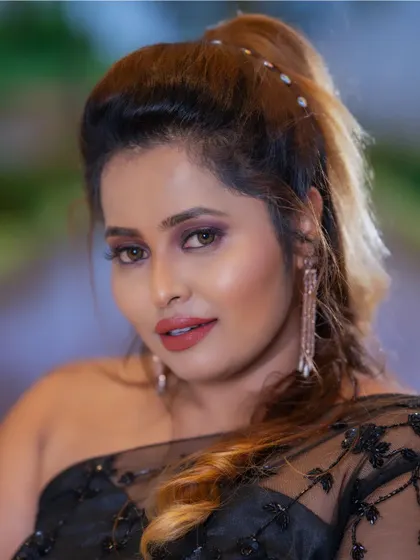 A glamorous party look created by a student. The soft smokey eye, glossy lips, and stylish ponytail make for a perfect evening look.